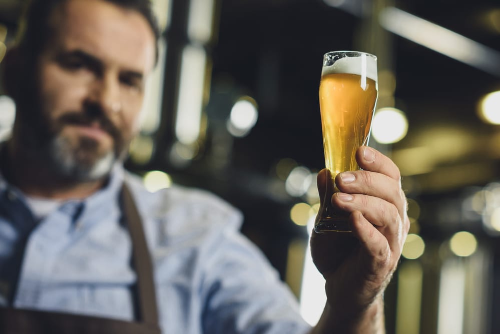 A man holding a glass of beer — One of the premier events in Lewisville, Texas for the fall of 2018 is their "Best Little Brewfest"