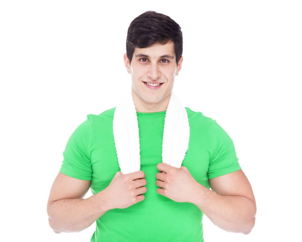 A young man in a green t-shirt and a white towel around his neck looks at the camera. Does he know the Low T cutoff is different for younger men?